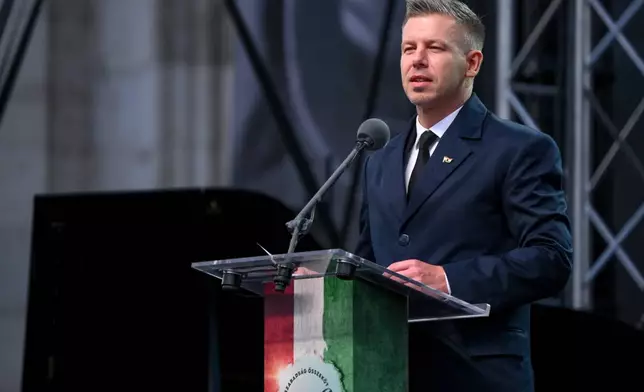 Hungarian Prime Minister Peter Magyar speaks during the commemoration of the 70th anniversary of the outbreak of the Hungarian Revolution and Freedom Fight of 1956 against Soviet oppression at the Kossuth square, in front of the Parliament in Budapest, Hungary, Friday, Oct. 23, 2026. (Boglarka Bodnar/MTI via AP)