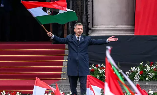 Hungarian Prime Minister Peter Magyar attends the commemoration for the 70th anniversary of Hungary’s 1956 anti-Soviet uprising, at Kossuth square, in front of Parliament in Budapest, Hungary, Friday, Oct. 23, 2026. (Szilard Koszticsak/MTI via AP)