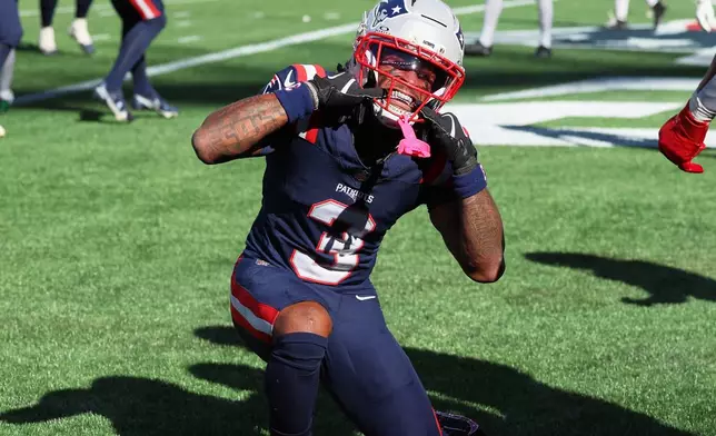 New England Patriots wide receiver DeMario Douglas (3) celebrates after scoring a touchdown during the first half of an NFL football game against the New York Jets in Foxborough, Mass., Sunday, Oct. 18, 2026. (AP Photo/Mark Stockwell)