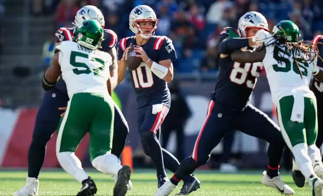New England Patriots quarterback Drake Maye (10) stands back to pass during the second half of an NFL football game against the New England Patriots in Foxborough, Mass., Sunday, Oct. 18, 2026. (AP Photo/Charles Krupa)