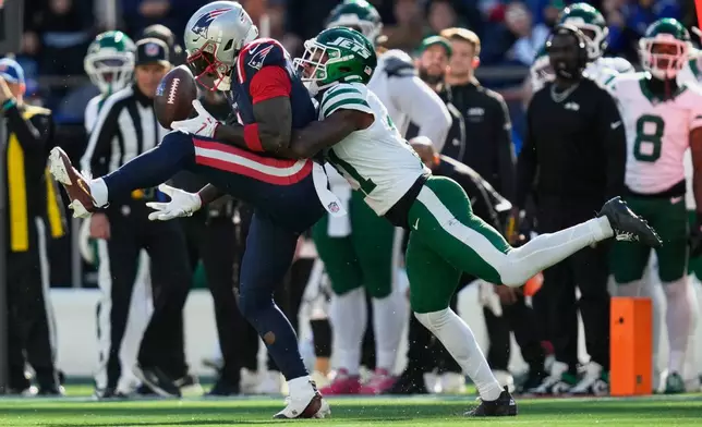 New England Patriots wide receiver A.J. Brown, left, can't make a catch as New York Jets cornerback Brandon Stephens, right, defends during the second half of an NFL football game in Foxborough, Mass., Sunday, Oct. 18, 2026. (AP Photo/Charles Krupa)