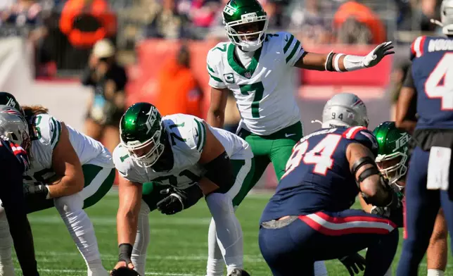 New York Jets quarterback Geno Smith (7) calls a play during the first half of an NFL football game against the New England Patriots in Foxborough, Mass., Sunday, Oct. 18, 2026. (AP Photo/Charles Krupa)