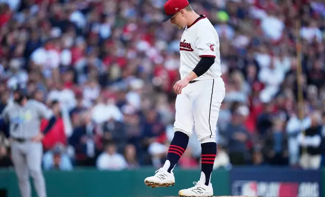 Cleveland Guardians pitcher Parker Messick reacts after walking in a run against the Tampa Bay Rays during the first inning in Game 5 of an American League Championship Series baseball game in Cleveland, Sunday, Oct. 18, 2026. (AP Photo/David J. Phillip)