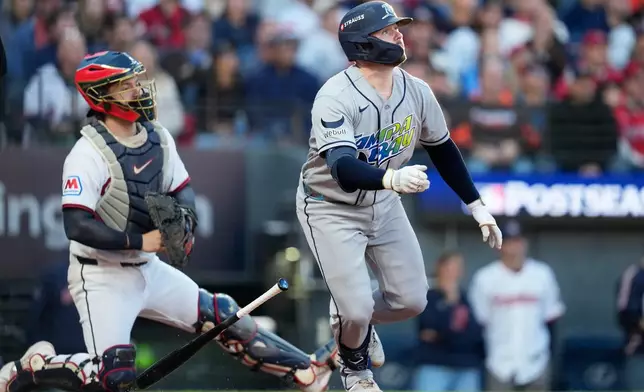 Tampa Bay Rays' Liam Hicks watches his RBI-single against the Cleveland Guardians during the third inning in Game 5 of an American League Championship Series baseball game in Cleveland, Sunday, Oct. 18, 2026. (AP Photo/David J. Phillip)