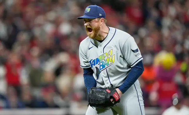 Tampa Bay Rays pitcher Drew Rasmussen celebrates the end of the seventh inning against the Cleveland Guardians in Game 5 of an American League Championship Series baseball game in Cleveland, Sunday, Oct. 18, 2026. (AP Photo/David J. Phillip)