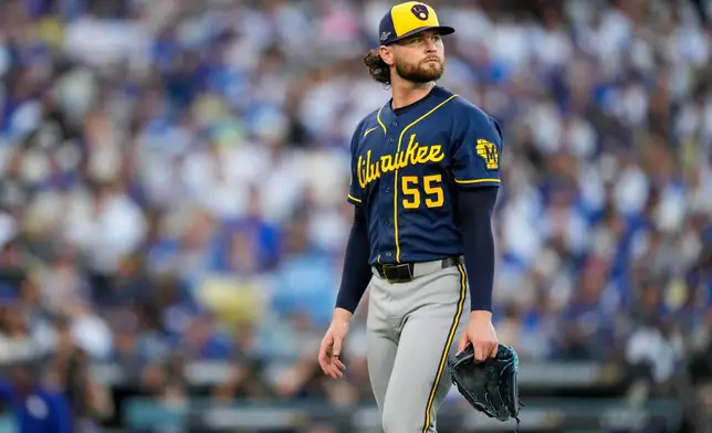 Milwaukee Brewers pitcher Shane Drohan leaves the game during the second inning of Game 4 of baseball's National League Championship Series between the Milwaukee Brewers and the Los Angeles Dodgers, Thursday, Oct. 15, 2026, in Los Angeles. (AP Photo/Ashley Landis)