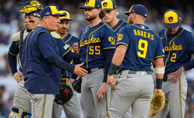 Milwaukee Brewers manager Pat Murphy, left, pulls Milwaukee Brewers pitcher Shane Drohan (55) from the game during the second inning of Game 4 of baseball's National League Championship Series between the Milwaukee Brewers and the Los Angeles Dodgers, Thursday, Oct. 15, 2026, in Los Angeles. (AP Photo/Ashley Landis)