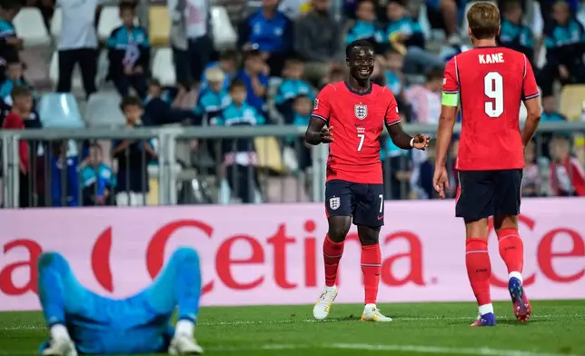England's Bukayo Saka and Harry Kane react after Saka scored his side's sixth goal during the Nations League soccer match between Croatia and England in Rijeka, Croatia, Saturday, Oct. 3, 2026. (AP Photo/Darko Bandic)