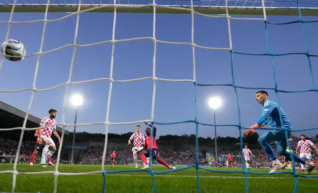 England's Bukayo Saka, center, scores during the Nations League soccer match between Croatia and England in Rijeka, Croatia, Saturday, Oct. 3, 2026. (AP Photo/Darko Bandic)