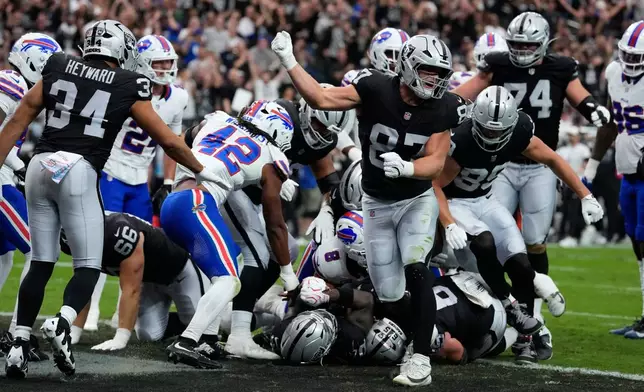 Las Vegas Raiders tight end Michael Mayer (87) celebrates a touchdown against the Buffalo Bills during an NFL football game in Las Vegas, Sunday, Oct. 18, 2026. (AP Photo/John Locher)