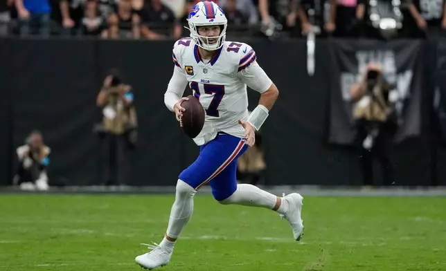 Buffalo Bills quarterback Josh Allen (17) scrambles as he looks to throw against the Las Vegas Raiders during an NFL football game in Las Vegas, Sunday, Oct. 18, 2026. (AP Photo/John Locher)