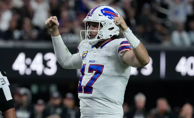 Buffalo Bills quarterback Josh Allen (17) celebrates a touchdown against the Las Vegas Raiders during the second half of an NFL football game in Las Vegas, Sunday, Oct. 18, 2026. (AP Photo/John Locher)