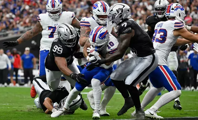 Buffalo Bills wide receiver Khalil Shakir (10) runs for a touchdown against the Las Vegas Raiders during an NFL football game in Las Vegas, Sunday, Oct. 18, 2026. (AP Photo/David Becker)