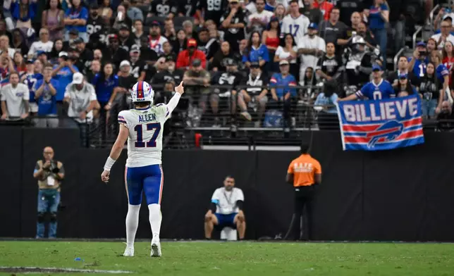 Buffalo Bills quarterback Josh Allen (17) celebrates with fans during the second half of an NFL football game against the Las Vegas Raiders in Las Vegas, Sunday, Oct. 18, 2026. (AP Photo/David Becker)