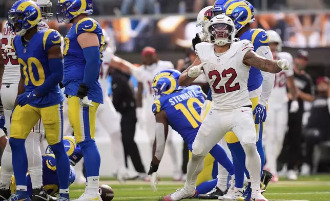 Arizona Cardinals running back Tyler Allgeier (22) reacts after converting a first down during the second half of an NFL football game against the Los Angeles Rams in Inglewood, Calif., Sunday, Oct. 18, 2026. (AP Photo/Gregory Bull)
