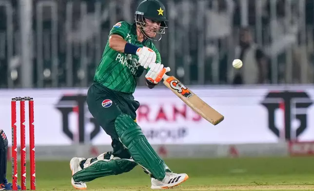 Pakistan's Maaz Sadaqat plays a shot during the first T20 cricket match between Pakistan and Sri Lanka, in Rawalpindi, Pakistan, Friday, Oct. 9, 2026. (AP Photo/Anjum Naveed)