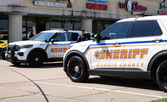 Harris County Sheriff deputies work the scene after a man was struck by an ICE agent's vehicle during an immigration enforcement in northwest Houston, Saturday, Oct. 10, 2026. 9Jason Fochtman/Houston Chronicle via AP)