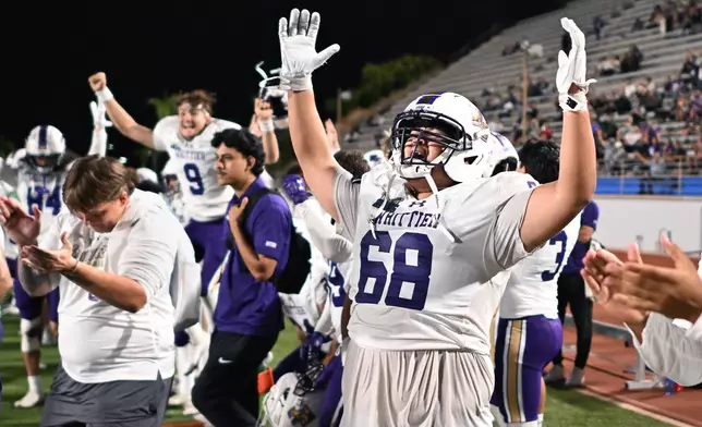 Whittier College lineman Isaac Ruiz (68) celebrates a touchdown against Azusa Pacific during an NCAA Division III college football game on Saturday, Sept. 19, 2026, in Glendora, Calif. (AP Photo/Wally Skalij)