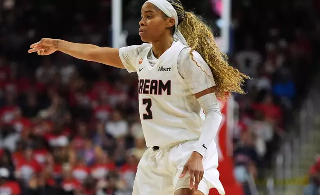 Atlanta Dream guard Jordin Canada (3) celebrates after making a three-point basket against the Washington Mystics during the second half in Game 2 of a WNBA basketball first-round playoff series, Wednesday, Sept. 30, 2026, in Washington. (AP Photo/Stephanie Scarbrough)