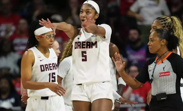 Atlanta Dream forward Angel Reese (5) reacts after being fouled against during the first half in Game 2 of a WNBA basketball first-round playoff series against the Washington Mystics, Wednesday, Sept. 30, 2026, in Washington. (AP Photo/Stephanie Scarbrough)