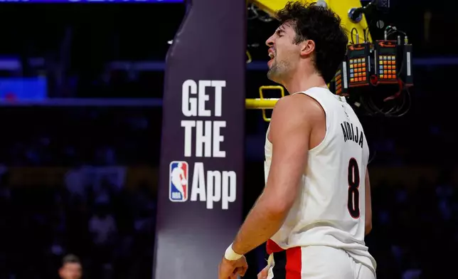 Portland Trail Blazers forward Deni Avdija (8) reacts after scoring during the first half of an NBA basketball game against the Los Angeles Lakers, Tuesday, Oct. 27, 2026, in Los Angeles. (AP Photo/Caroline Brehman)