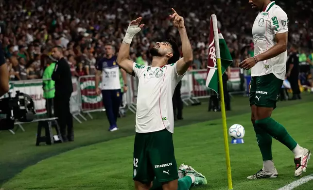Flaco Lopez of Brazil's Palmeiras celebrates after scoring his side's opening goal against Brazil's Fluminense during the first leg of a Copa Libertadores semifinal soccer match in Rio de Janeiro, Wednesday, Oct. 14, 2026. (AP Photo/Bruna Prado)