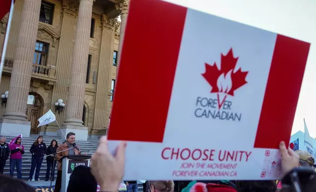 Forever Canada leader Thomas Lukaszuk, left, gives a speech during a pro-Canada rally in Edmonton, Alberta, Sunday, Oct, 18, 2026. (Timon Johnson/The Canadian Press via AP)
