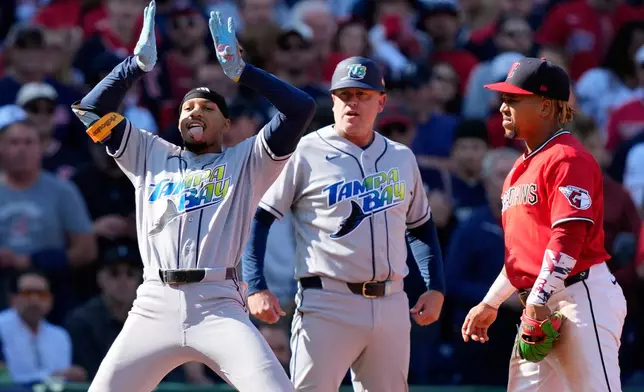 Tampa Bay Rays' Chandler Simpson celebrates a two-run triple against the Cleveland Guardians during the fourth inning in Game 3 of an American League Championship Series baseball game in Cleveland, Thursday, Oct. 15, 2026. (AP Photo/David J. Phillip)