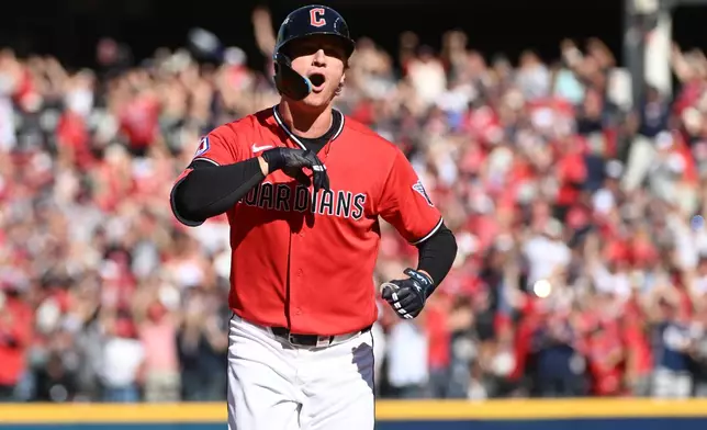 Cleveland Guardians' Petey Halpin celebrates after hitting a two-run home run during the fifth inning in Game 3 against the Tampa Bay Rays in baseball's American League Championship Series in Cleveland, Thursday, Oct. 15, 2026. (AP Photo/Phil Long)