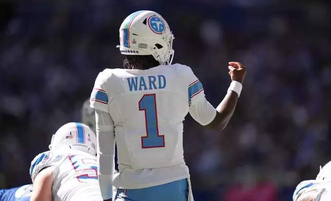 Tennessee Titans quarterback Cam Ward (1) gives direction at the line of scrimmage during the first half of an NFL football game against the Indianapolis Colts, Sunday, Oct. 18, 2026, in Indianapolis. (AP Photo/Jeff Roberson)