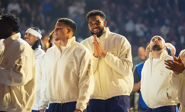 New York Knicks center Karl-Anthony Towns gestures before an NBA basketball game between the New York Knicks and the Philadelphia 76ers Tuesday, Oct. 20, 2026, in New York. (AP Photo/Frank Franklin II)