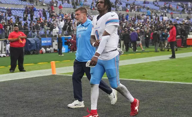 Tennessee Titans quarterback Cam Ward (1) walks off the field after the team's loss in an NFL football game against the Baltimore Ravens in Baltimore, Sunday, Oct. 4, 2026. (AP Photo/Stephanie Scarbrough)