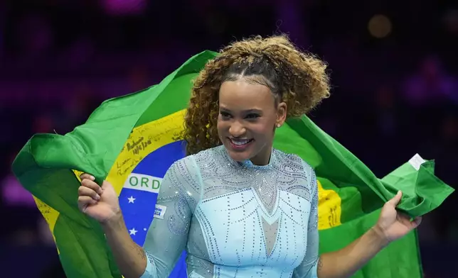 Rebeca Andrade, of Brazil, celebrates after winning the gold medal in the vault during the apparatus finals at the Artistic Gymnastics World Championships in Rotterdam, the Netherlands, Saturday, Oct. 24, 2026. (AP Photo/Francisco Seco)