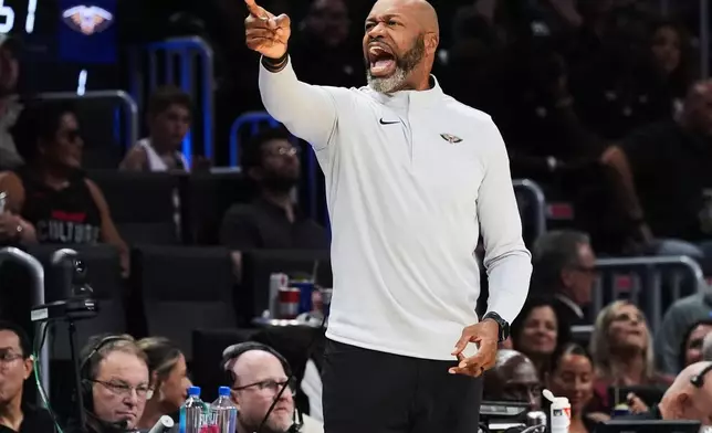 New Orleans Pelicans head coach Jamahl Mosley gesture during the first half of an NBA preseason basketball game against the Miami Heat Thursday, Oct. 8, 2026, in Miami. (AP Photo/Marta Lavandier)