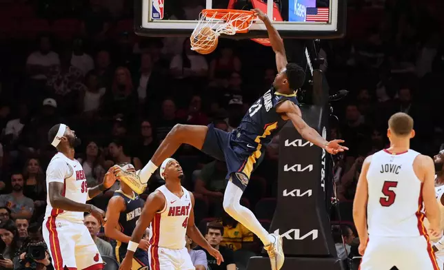 New Orleans Pelicans center Yves Missi (21) dunks the ball during the second half of an NBA preseason basketball game against the Miami Heat Thursday, Oct. 8, 2026, in Miami. (AP Photo/Marta Lavandier)