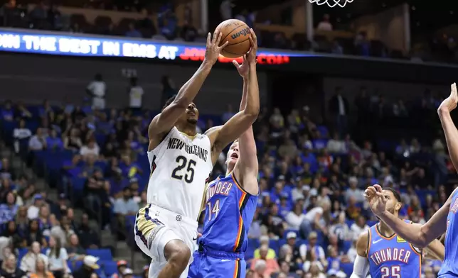 New Orleans Pelicans' forward Trey Murphy III (25) shoots by Oklahoma City Thunder's guard Bennett Stirtz (14) during the first half of an NBA basketball game, Tuesday, Oct. 6, 2026, in Tulsa, Okla. (AP Photo/Joey Johnson)