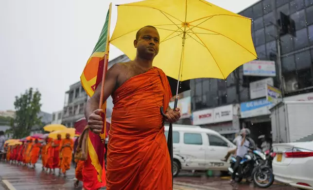 Sri Lankan Buddhist monks march in protest demanding the release of imprisoned nationalist leader and Buddhist monk Galagoda Aththe Gnanasara in Colombo, Sri Lanka, Thursday, Oct. 15, 2026. (AP Photo/Eranga Jayawardena)
