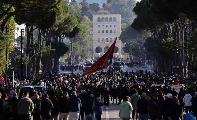 Protesters gather during clashes at an anti-government demonstration in Tirana, Albania, Sunday, Oct. 18, 2026. (AP Photo/Hameraldi Agolli)
