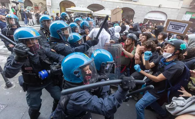 Police confront "Italia in Piazza" protesters in Milan, Italy, on Saturday, Oct. 17, 2026. (Stefano Porta/LaPresse via AP)