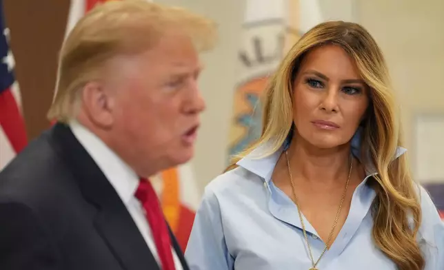First lady Melania Trump listens as President Donald Trump speaks after casting their early-voting ballots for the 2026 midterm elections at the Palm Beach County Library in West Palm Beach, Fla., Saturday, Oct. 24, 2026. (AP Photo/Mark Schiefelbein)