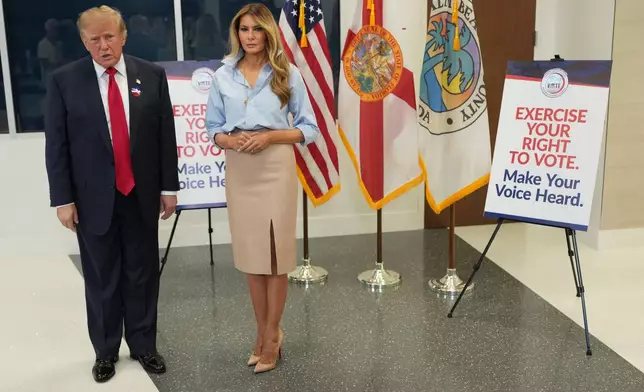 President Donald Trump speaks alongside first lady Melania Trump after casting his early-voting ballot for the 2026 midterm elections at the Palm Beach County Library in West Palm Beach, Fla., Saturday, Oct. 24, 2026. (AP Photo/Mark Schiefelbein)