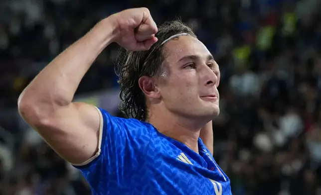 Italy's Pio Esposito celebrates after scoring his side's third goal during the UEFA Nations League soccer match between Italy and Turkey in Bologna, Italy, Monday, Oct. 5, 2026. (AP Photo/Antonio Calanni)