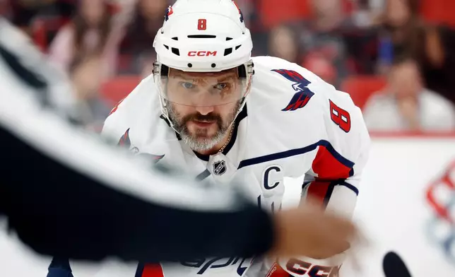 Washington Capitals' Alex Ovechkin watches the puck during the first period of an NHL hockey game against the Carolina Hurricanes in Raleigh, N.C., Friday, Oct. 2, 2026. (AP Photo/Karl DeBlaker)