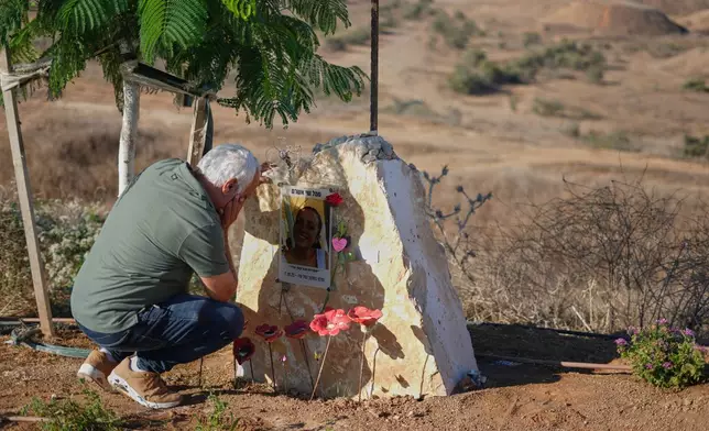 Dror Ashram, father of Sergeant Shay Ashram, attends a memorial service marking the third anniversary of the Oct. 7, 2023, Hamas cross-border attack on Israel, near Kibbutz Nahal Oz, southern Israel, in which his daughter and other female Israeli observer soldiers were killed, Wednesday, Oct. 7, 2026. (AP Photo/Ariel Schalit)