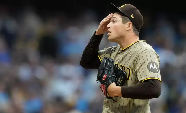 San Diego Padres' Mason Miller reacts during the ninth inning of Game 2 of a National League Divisional baseball playoff series against the Milwaukee Brewers Sunday, Oct. 4, 2026, in Milwaukee. (AP Photo/Kayla Wolf)