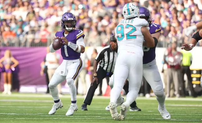 Minnesota Vikings quarterback Kyler Murray looks to pass against the Miami Dolphins during the first half of an NFL football game Sunday, Oct. 4, 2026, in Minneapolis. (AP Photo/Matt Krohn)