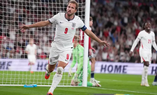 England's Harry Kane celebrates after scoring third goal during the UEFA Nations League soccer match between England and Czechia in London, Tuesday, Oct. 6, 2026. (AP Photo/Kirsty Wigglesworth)
