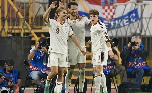 Spain's Mikel Merino, center, celebrates scoring his side's 2nd goal during a Nations League soccer match between Croatia and Spain in Split, Croatia, Tuesday, Oct. 6, 2026. (AP Photo/Darko Bandic)