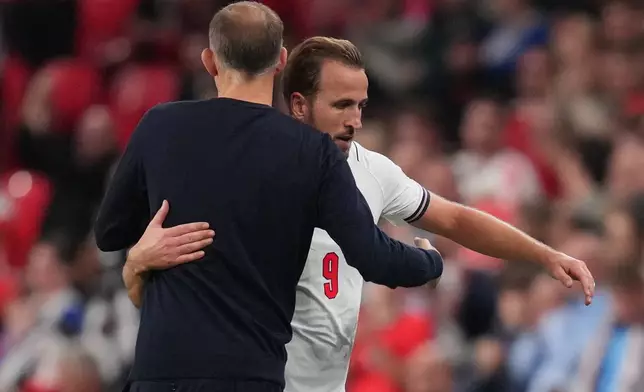 England's coach Thomas Tuchel hugs Harry Kane during the UEFA Nations League soccer match between England and Czechia in London, Tuesday, Oct. 6, 2026. (AP Photo/Kirsty Wigglesworth)