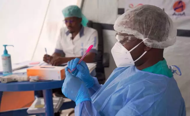 Doctors label a sample collected from a participant during clinical trials attempting to stop the rare Bundibugyo virus, amidst a deadly Ebola outbreak, in Rwampara Hospital in Ituri, Congo, Thursday, Oct. 1, 2026. (AP Photo/Dieudonne Dirole)
